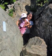 Susan carrying Kadia on Bearfence Rocks Trail